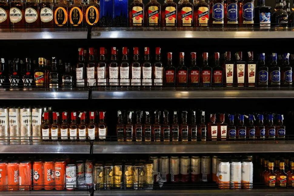 FILE PHOTO: Bottles of alcoholic beverages are displayed on shelves at a liquor store in Bengaluru, India, January 20, 2026. REUTERS/Priyanshu Singh/File Photo