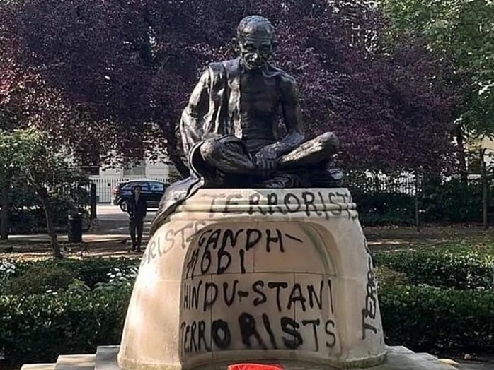Gandhi statue in London painted with Gandhi-Modi Hindustani terrorist